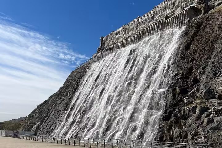 Khorfakkan Dam spillway waterfall viewpoint, scenic stop on Fujairah City and Khorfakkan day tour from Dubai
