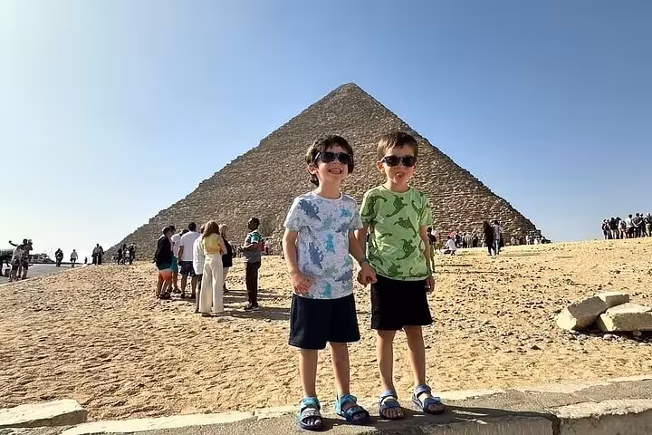Kids at the Great Pyramid of Giza on a family-friendly Cairo day tour led by an expert Egyptologist