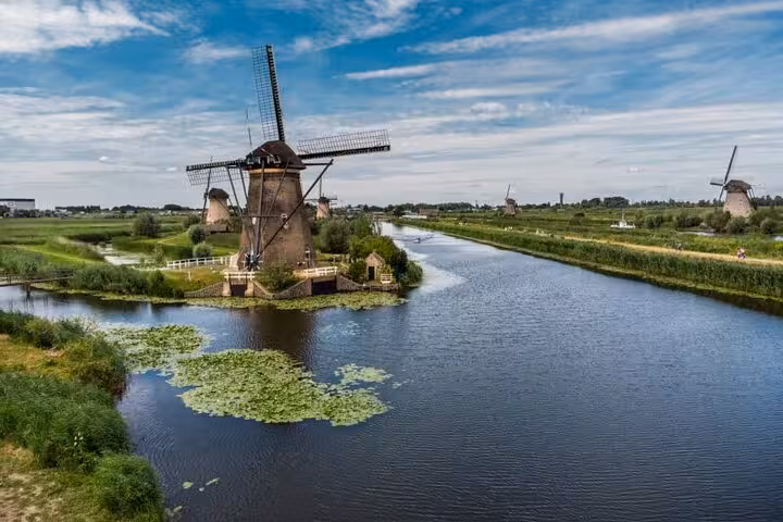 Kinderdijk windmills beside canals, iconic UNESCO view on private tour from Amsterdam to Kinderdijk and Delft