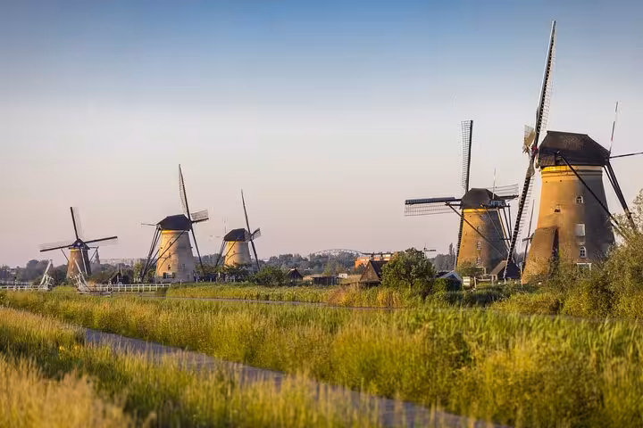 Kinderdijk UNESCO windmills at sunset, scenic stop on private tour from The Hague to Gouda
