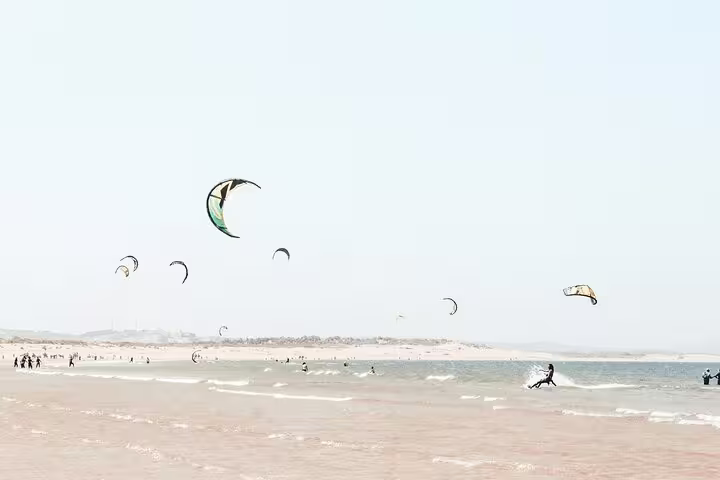 Kitesurfers on Essaouira beach, Atlantic coast Morocco, on a Marrakech to Essaouira day trip tour