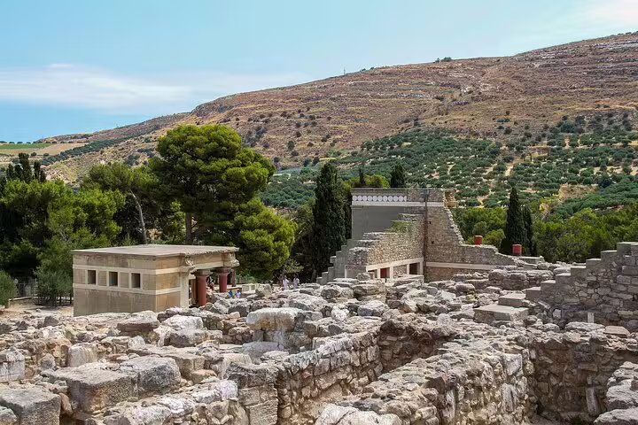 Discover the ancient ruins of Knossos Palace with stunning views, part of the private tour including Heraklion Town and Archaeological Museum.