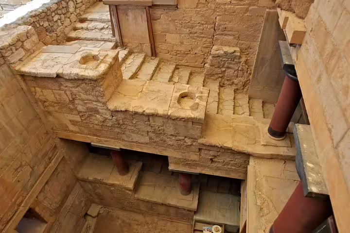 Explore the ancient ruins of Knossos Palace with its intricate architecture on a private tour including Heraklion Town and Archaeological Museum.