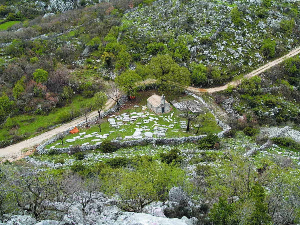 Aerial view of rural Konavle chapel and stone ruins in green valley, Dubrovnik countryside local experience