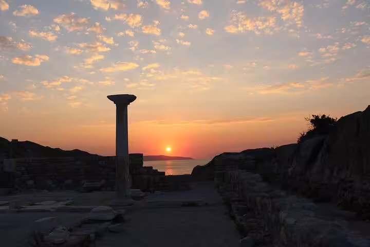 Stunning sunrise over ancient ruins in Kos, Greece, highlighting a tranquil morning yoga setting.