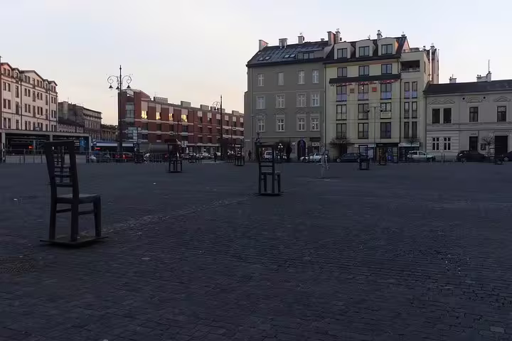 Krakow Ghetto Heroes Square with empty metal chairs, a key stop on a private half-day Krakow tour