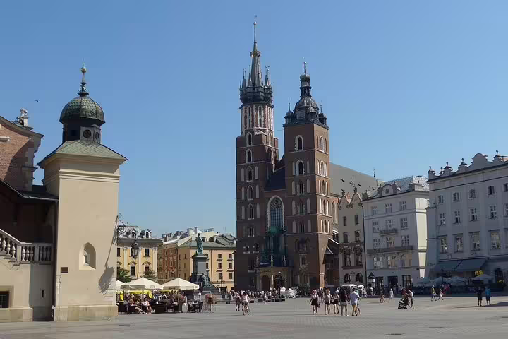 Wide view of Krakow Old Town with St. Mary’s Basilica on Rynek Glowny during private half-day sightseeing