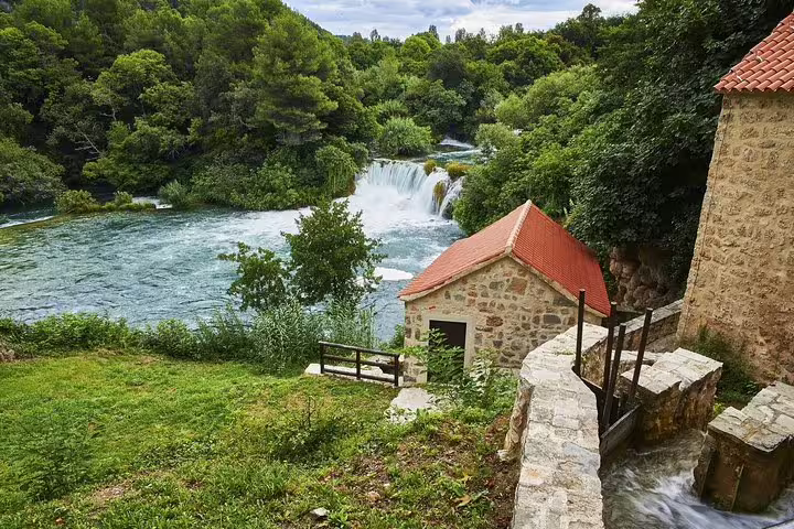 Stone watermill by river rapids near Skradinski Buk, scenic stop on Krka National Park and waterfalls tour