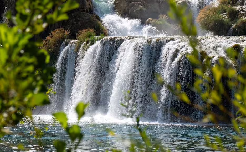 Close-up of Krka Waterfalls cascade and clear river in Krka National Park on a private guided tour