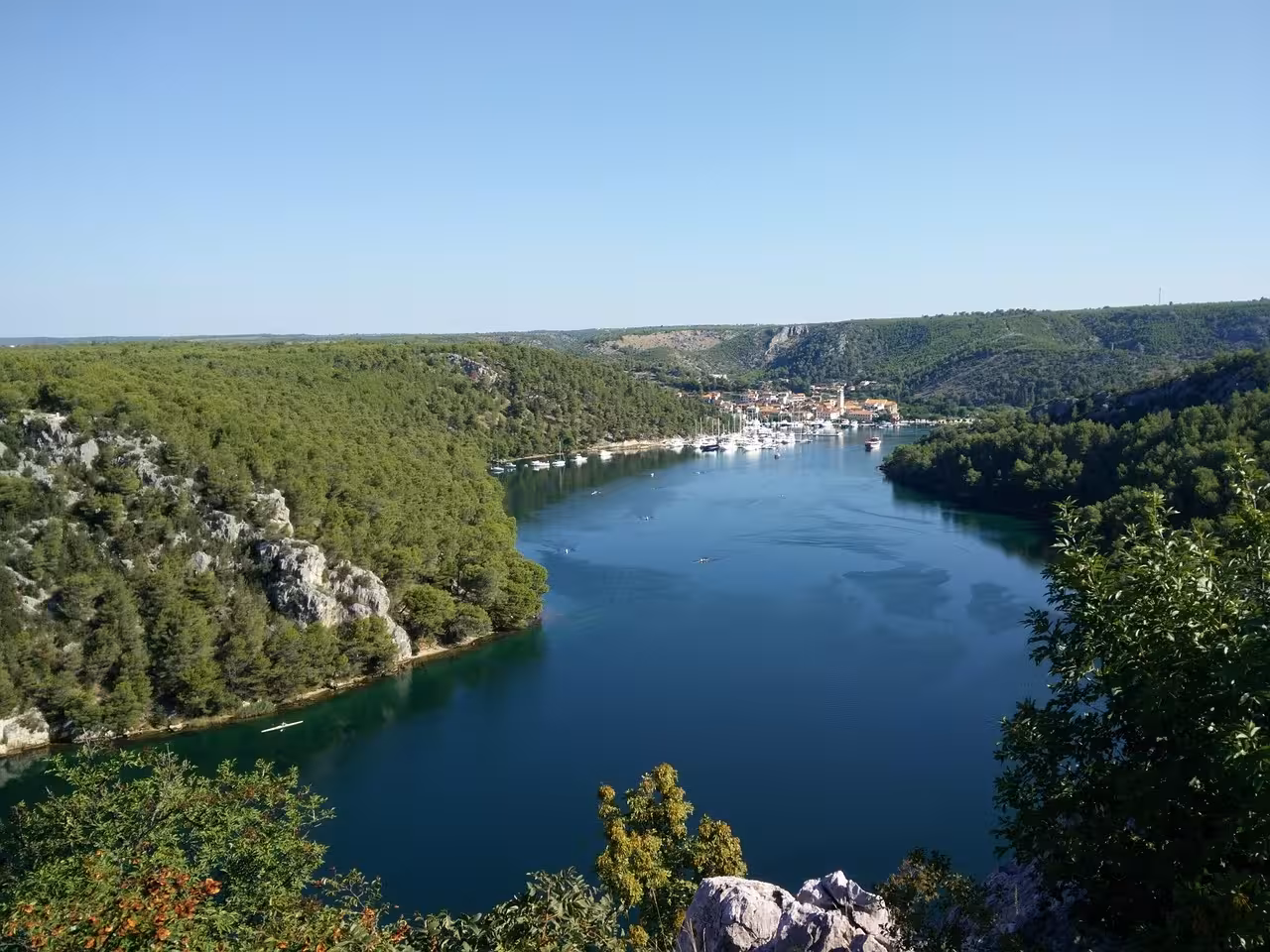 Panoramic Krka River lake cruise view toward Skradin marina, part of Krka Waterfalls & Old Town tour