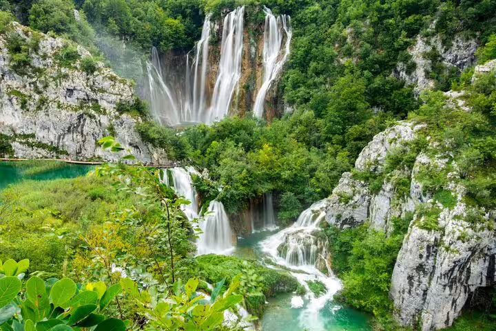 Panoramic Plitvice Lakes waterfalls and emerald pools on guided group adventure day tour from Split