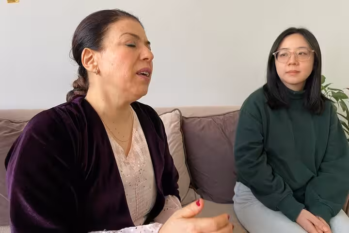 Kurdish Dengbeji singer sharing ancient vocal tradition in a private Istanbul music session with a guest