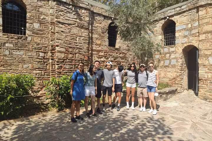 Kusadasi cruise port Ephesus tour group at House of Virgin Mary courtyard, skip-the-line guided excursion