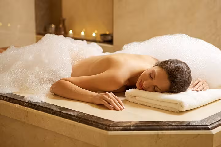 Relaxing foam massage on warm marble in Kusadasi Turkish hamam, add-on to private Ephesus tour