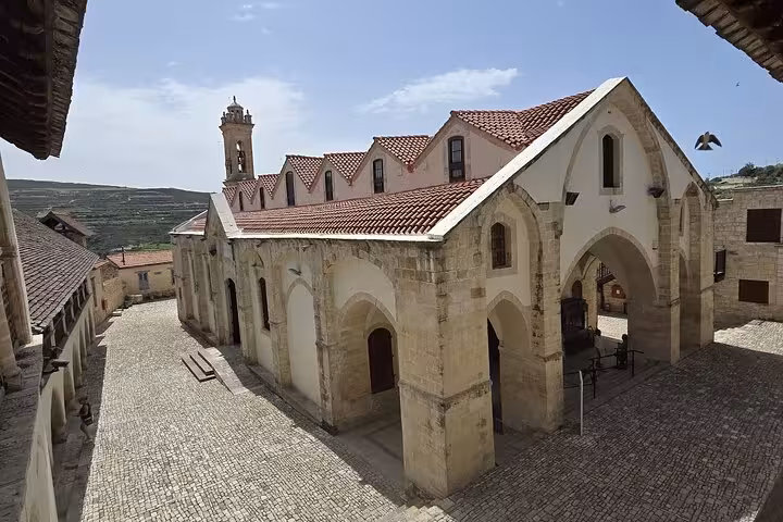 View of Kykkos Monastery church and cobbled courtyard in Troodos Mountains on Paphos day tour