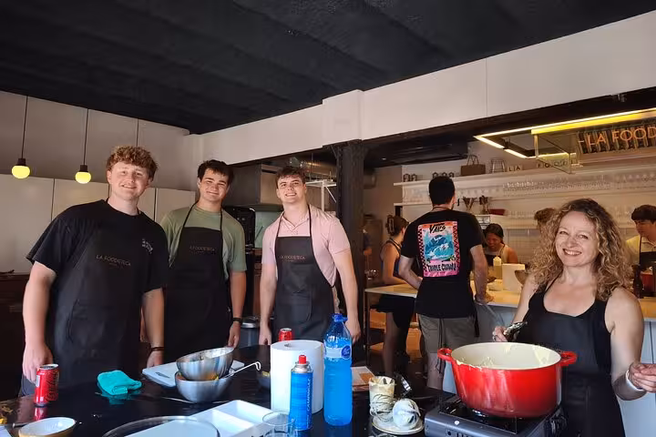 Participants enjoy cooking in the stylish La Boqueria Market Tour & Premium Cooking Class designer loft.