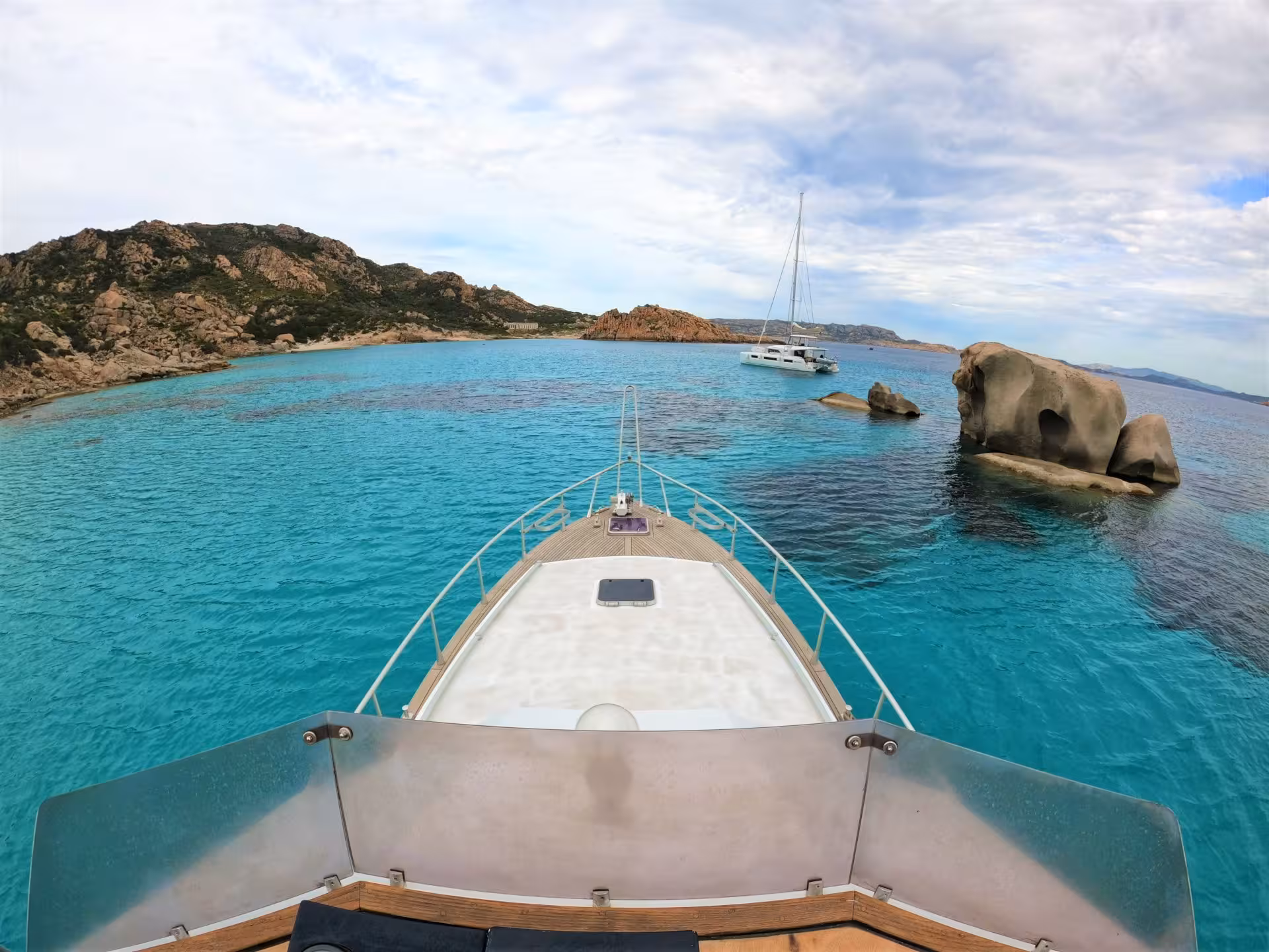 Sail through the serene La Maddalena Archipelago with stunning rock formations and crystal-clear sea views.