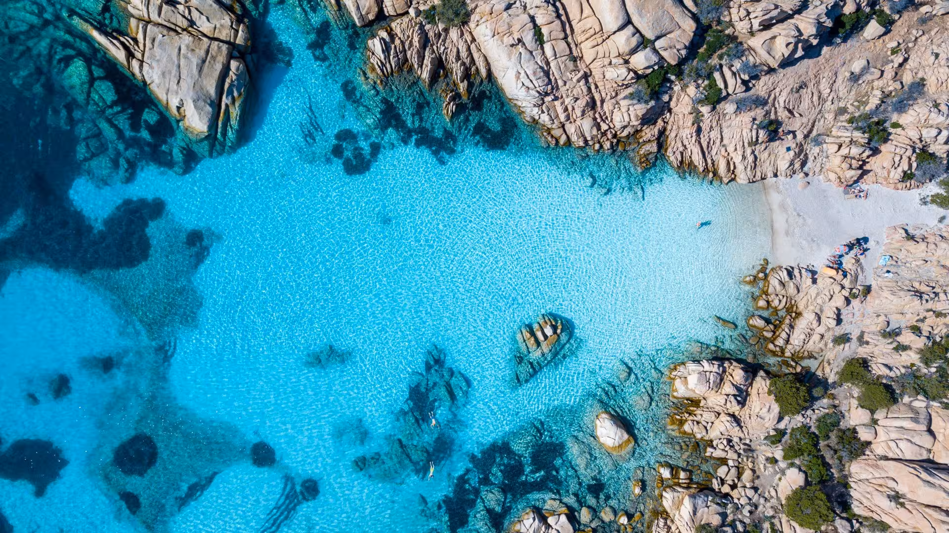 Discover the aerial beauty of La Maddalena Archipelago's clear waters and rocky shores on a private RIB tour.