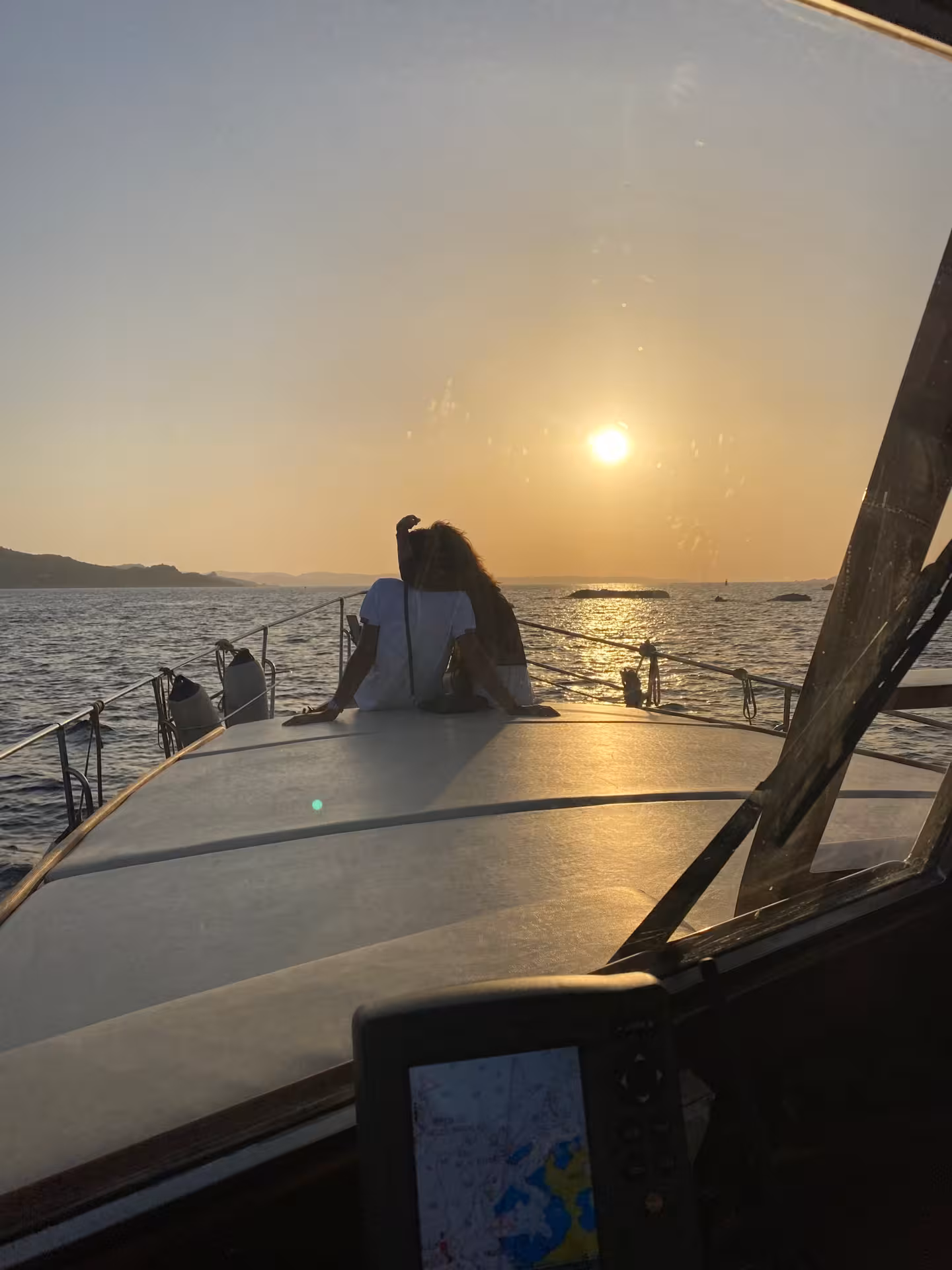 Enjoy a romantic sunset on a boat in La Maddalena Archipelago during a private evening tour.