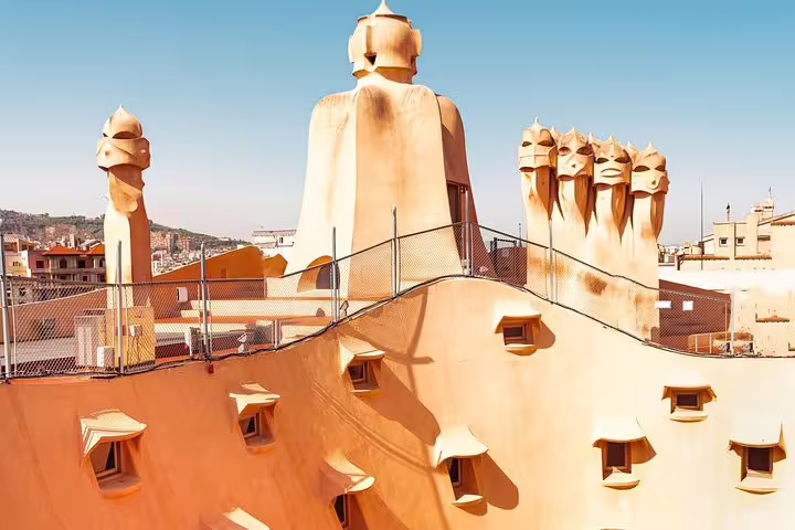 Stunning rooftop chimneys of La Pedrera in Barcelona, showcasing Gaudí's iconic architectural style.