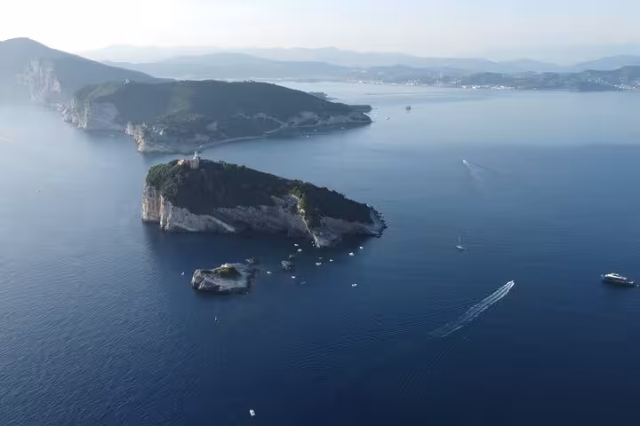 Aerial view of the scenic La Spezia islands with boats cruising the deep blue waters, perfect for a dream boat tour.