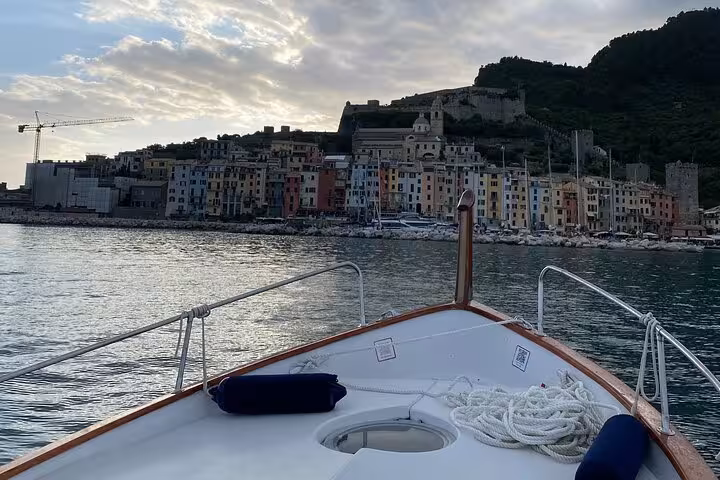 Front view from a boat cruising toward the charming colorful village of La Spezia at sunset in Golfo Dei Poeti.