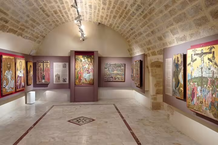 Explore vibrant religious art in the Lady of the Angels Monastery's historic gallery, showcasing Byzantine icons.