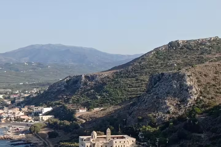 Scenic hillside landscape with the historic Lady of the Angels Monastery near Thousand Flowers Falasarna Beach.