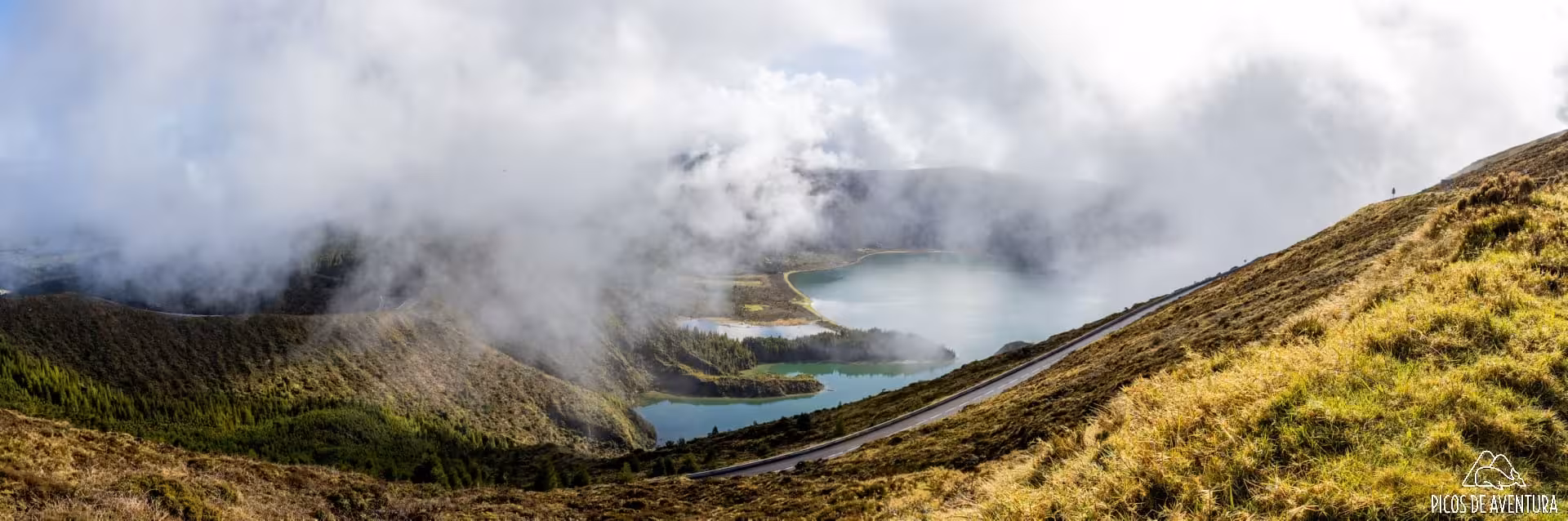 Misty Lagoa do Fogo crater lake panorama on São Miguel, Azores, scenic stop on van tour after whale watching