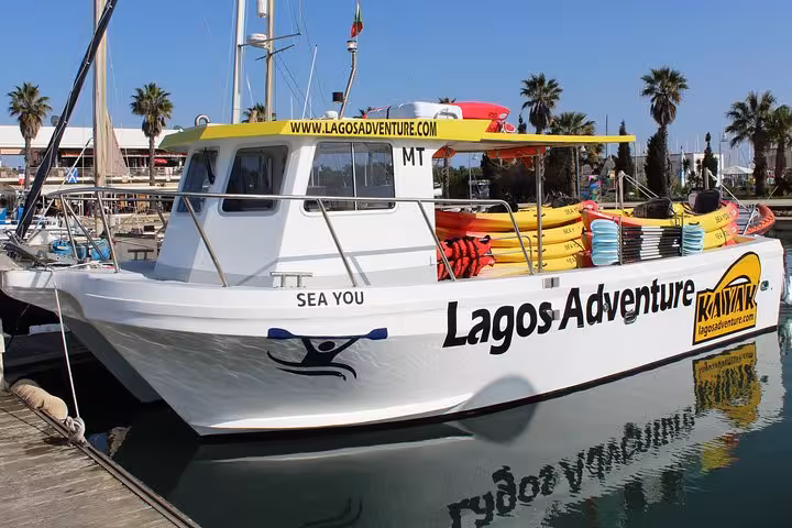 Lagos Adventure support boat at Lagos Marina for Ponta da Piedade kayak cave tour, Algarve Portugal