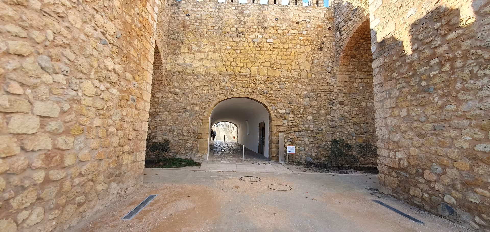 Explore ancient stone walls and archways on the Lagos Self Guided GPS Audio Tour in Portugal's historic center.