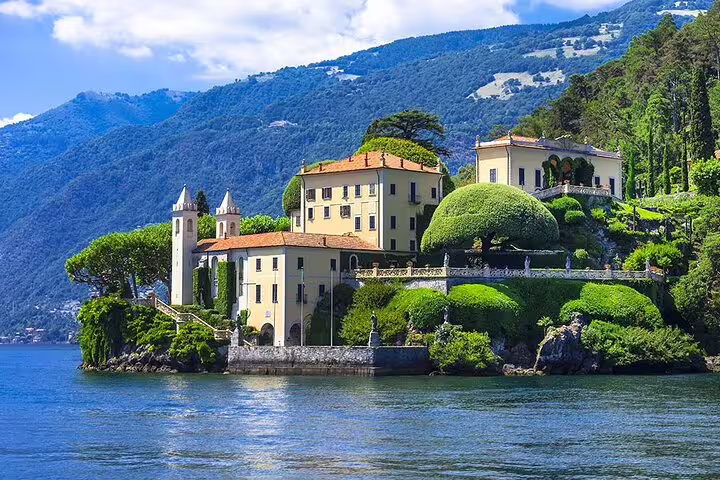 Elegant villa surrounded by lush gardens on the shores of Lake Como, ideal for picturesque private tours.