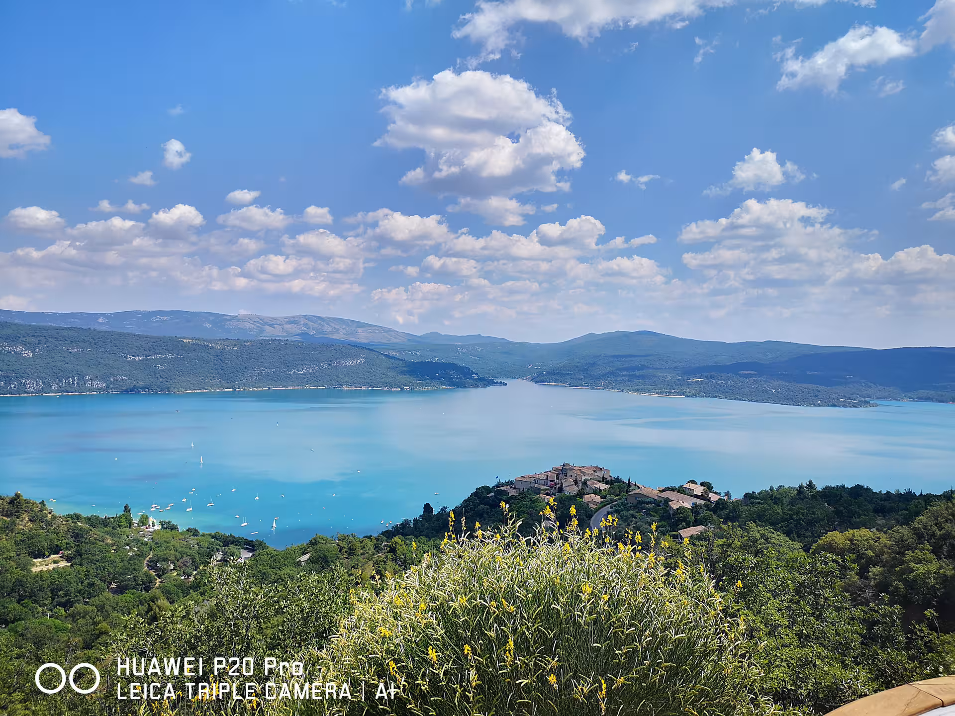 Panoramic view of Lake Sainte-Croix and hilltop village near Moustiers-Sainte-Marie on Marseille shore excursion