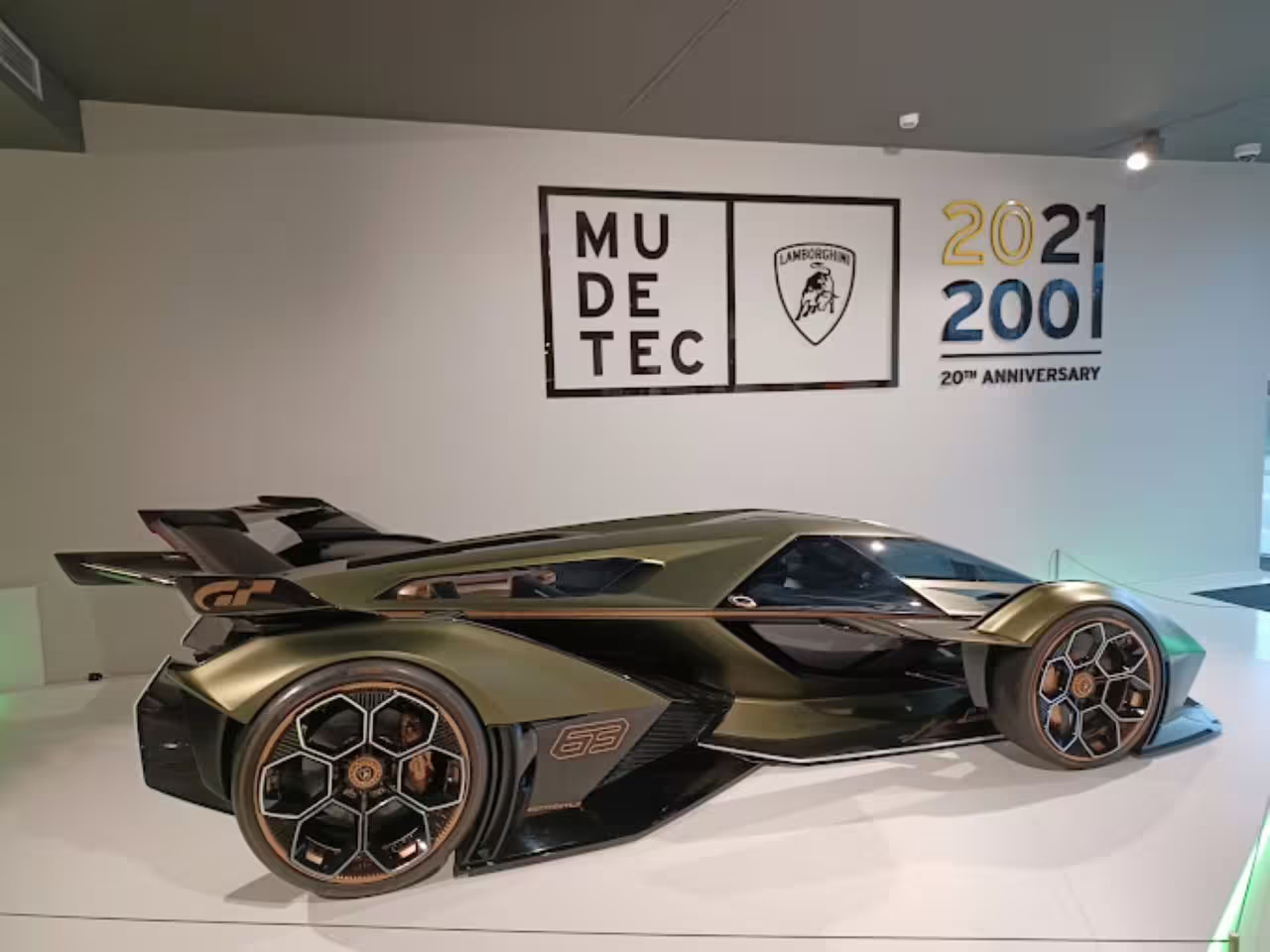 Futuristic Lamborghini concept car on display at Museo Lamborghini, celebrating 20th anniversary of innovation.