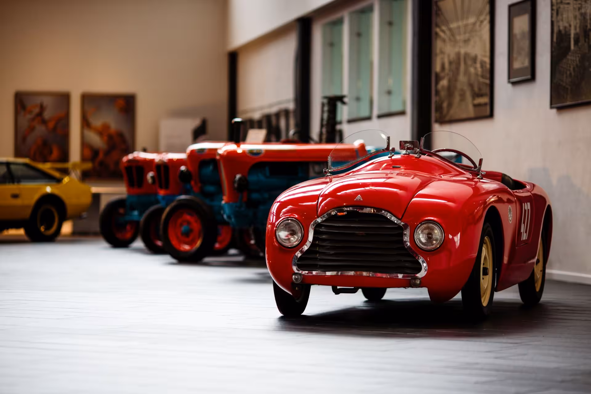 Classic red vintage car at Museo Lamborghini in Emilia-Romagna, part of the Lamborghini Ducati Ferrari museums combo tour