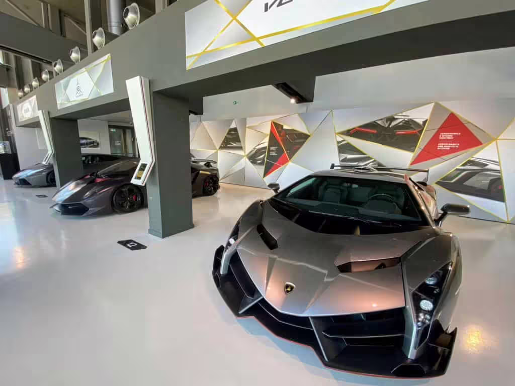 Futuristic Lamborghini models on exhibit at the Bologna Lamborghini Museum, included in the guided tour experience.