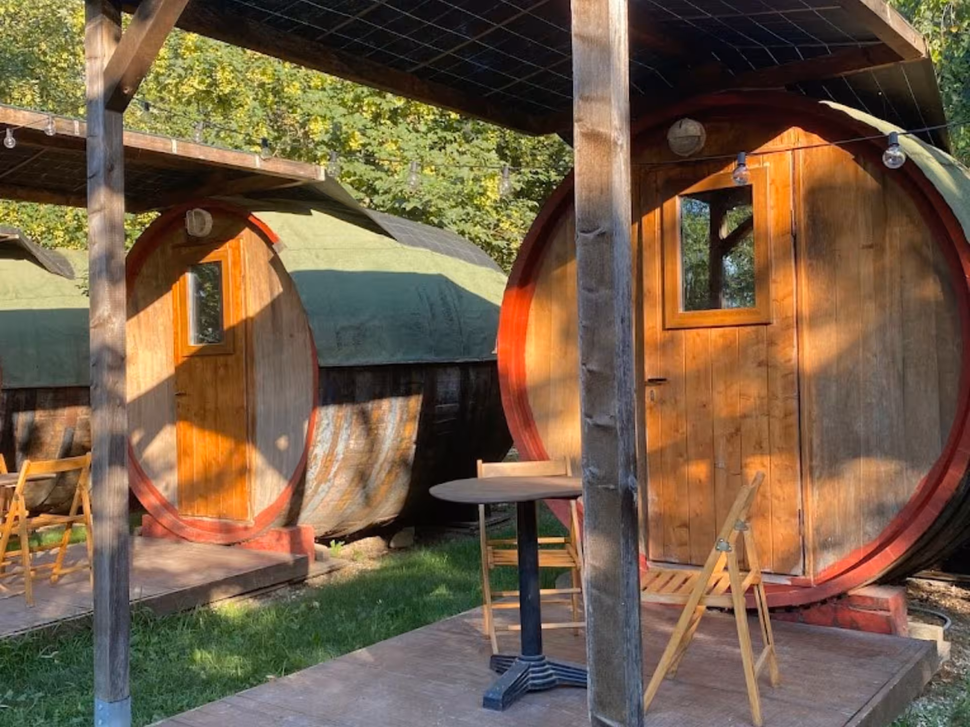 Cozy barrel cabins nestled in Langhe's serene landscape, perfect for a relaxing spa and wine retreat.