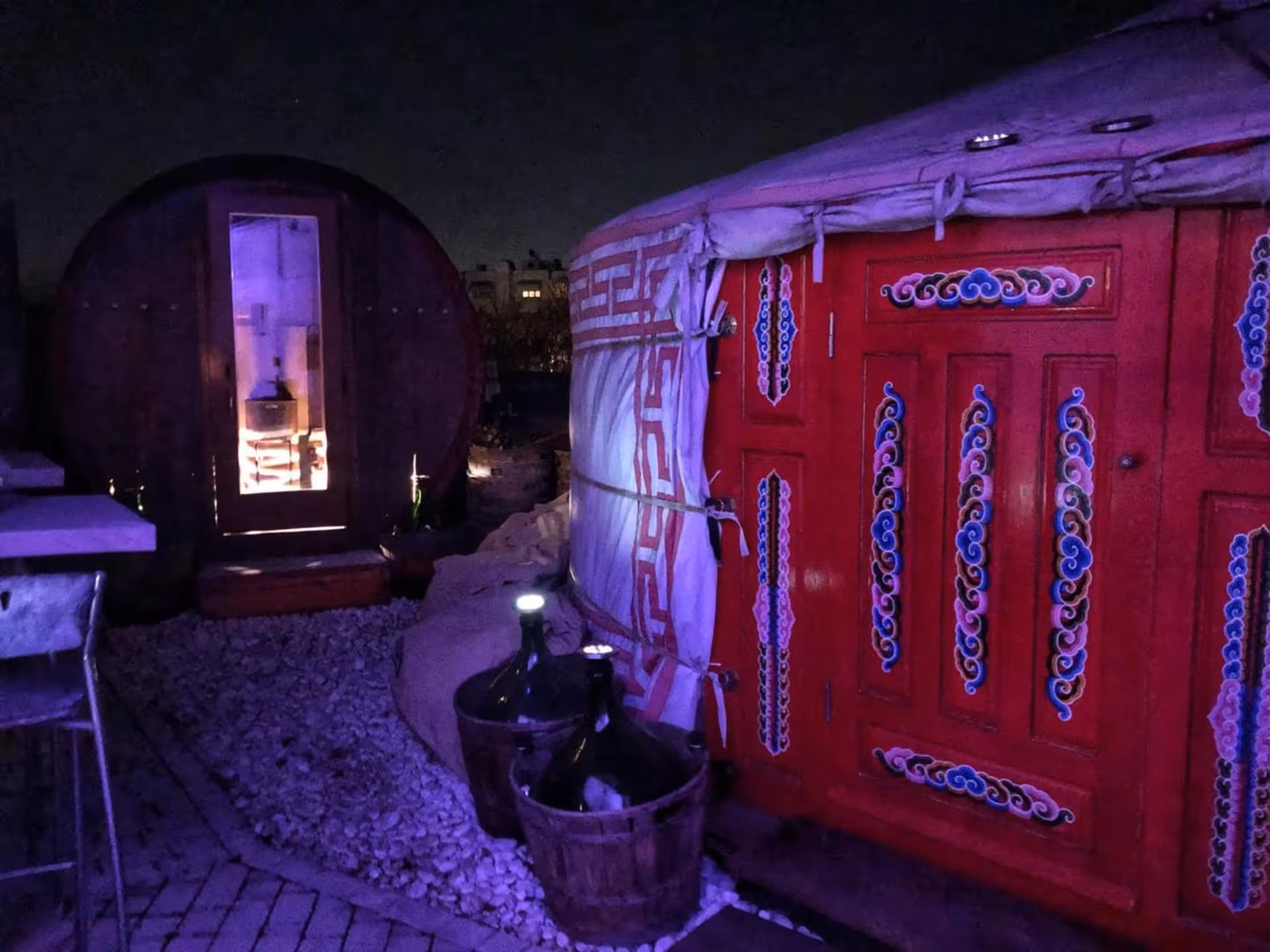 Unique Langhe wellness retreat featuring a traditional yurt and barrel sauna under starry night skies.