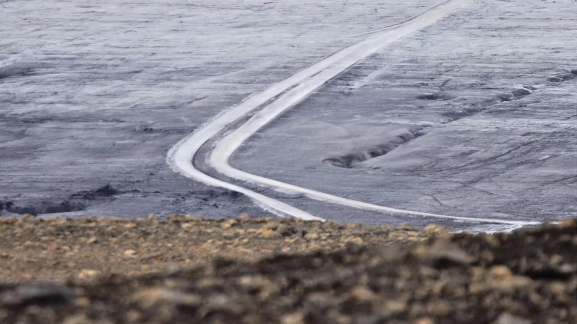 Snowy track across Langjökull Glacier, Iceland, on Summer Solstice tour from Gullfoss with glacier bus ride
