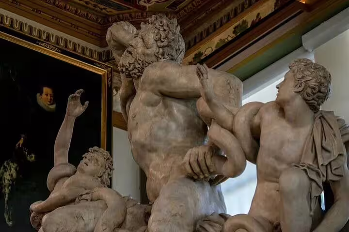 Dramatic ancient sculpture of Laocoön and sons inside the Uffizi Gallery on a Florence Uffizi and Accademia highlights guided tour