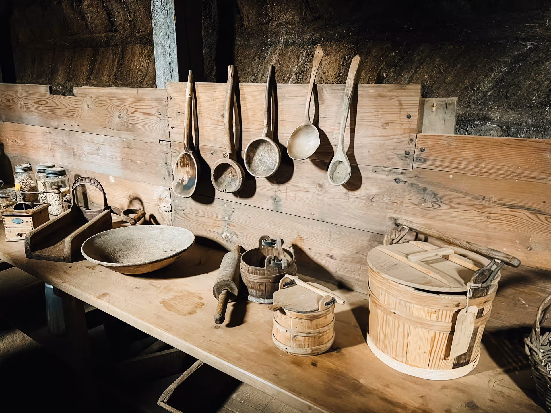 Historic Laufás Museum kitchen with wooden ladles and tools, part of the private Goðafoss and Forest Lagoon tour