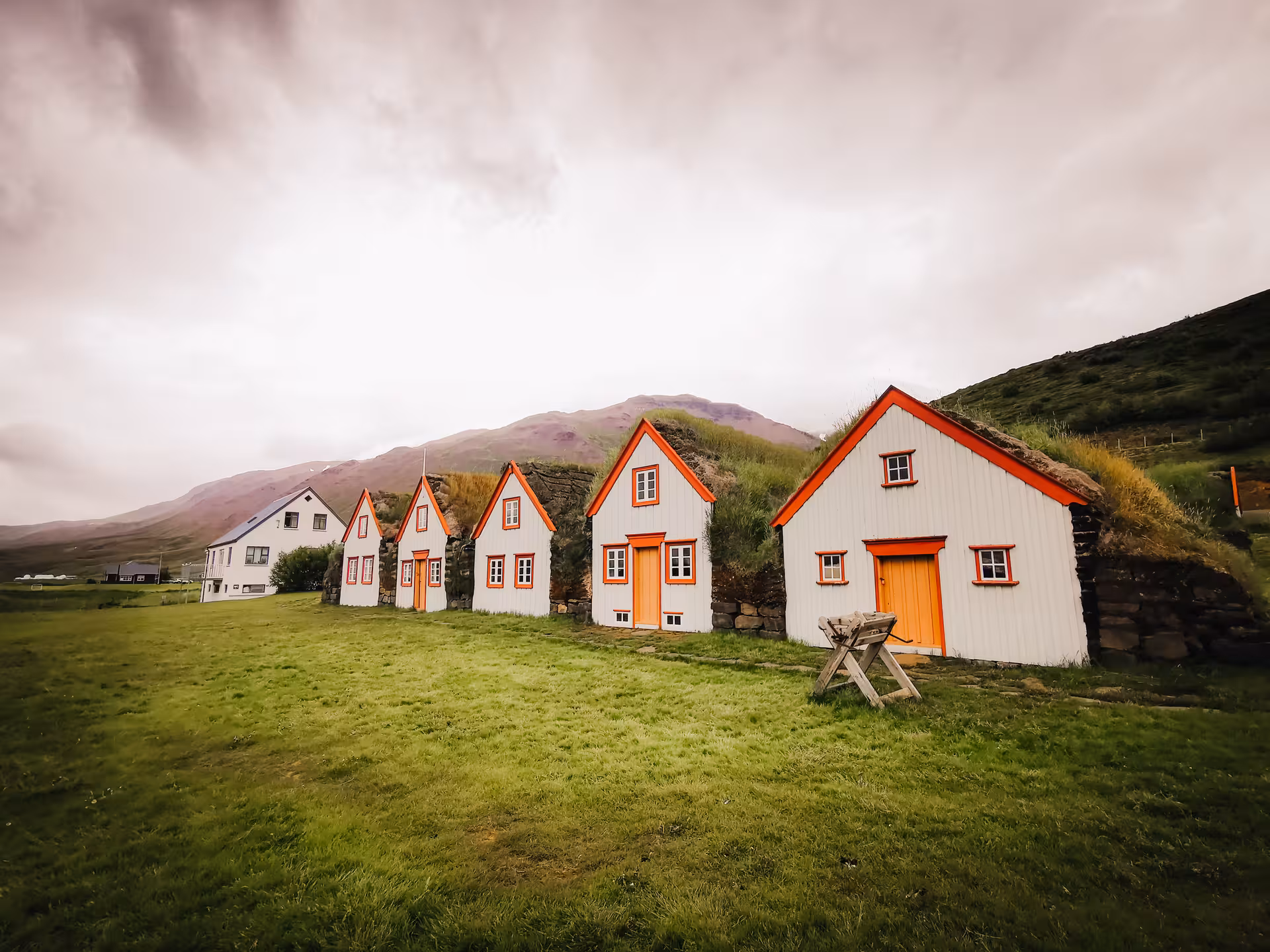 Traditional turf houses at Laufás Museum near Akureyri, cultural stop on Goðafoss and Forest Lagoon tour