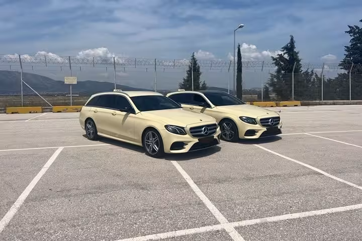 Private transfer vehicles from Lavrio Port to Athens Airport, comfortable taxi-style cars ready for pickup