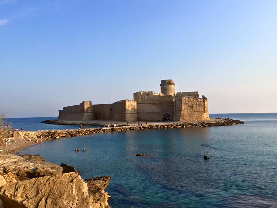 Le Castella fortress on the Ionian Sea in Calabria at sunset, scenic coastal stop on the 8 days self drive culinary tour