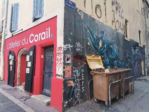 Colorful street corner with graffiti by L'atelier du Corail in Le Panier, Marseille’s oldest neighbourhood walk