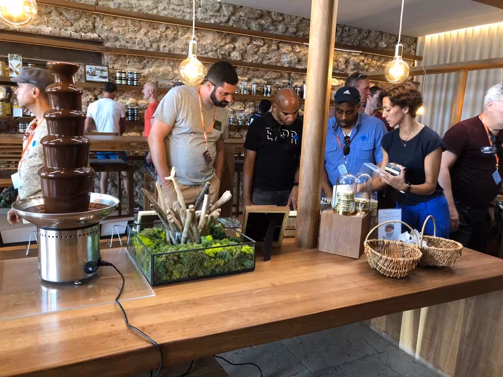 Tasting stop on Le Panier Marseille food tour with artisan chocolate fountain and local delicacies in a shop