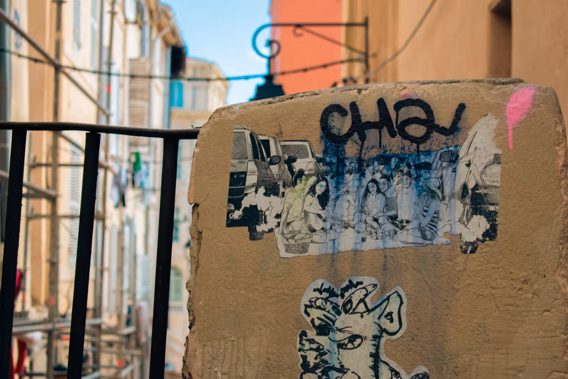 Graffiti and sticker art on a wall in Le Panier, Marseille, along a walking tour through the oldest neighbourhood