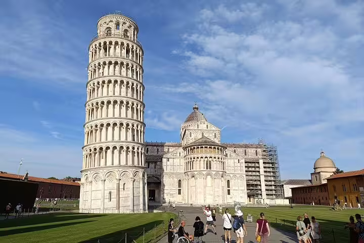 Leaning Tower of Pisa and Pisa Cathedral with tourists in Piazza dei Miracoli on a private tour from La Spezia cruise port