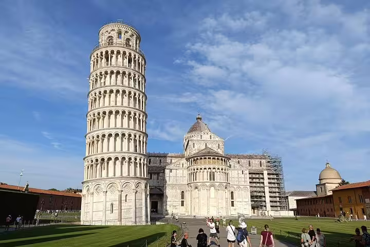 Visitors explore the Leaning Tower of Pisa and Pisa Cathedral on a sunny Tuscany day trip from La Spezia and Carrara