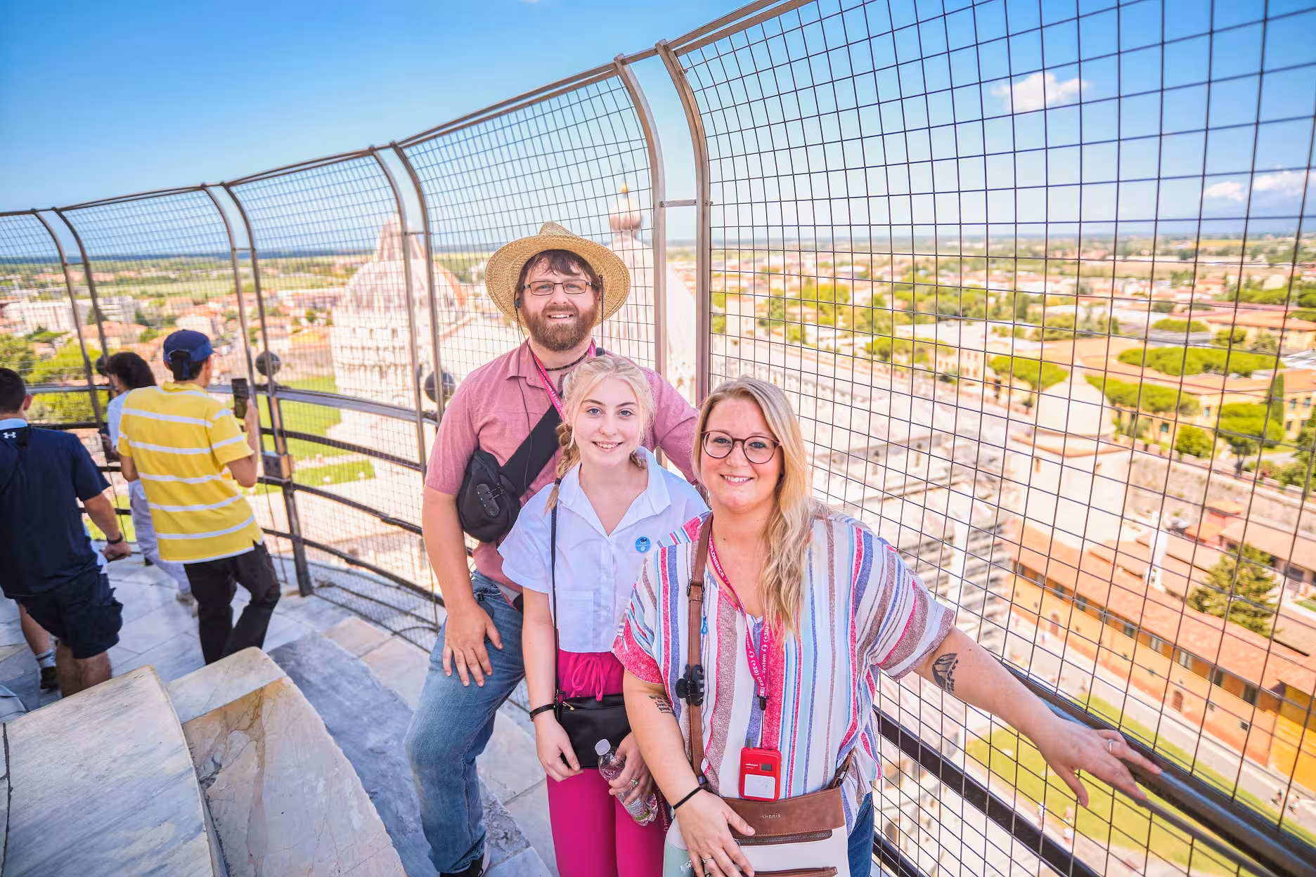 Visitors enjoying panoramic views from the top of the Leaning Tower of Pisa on a guided tour from Florence.